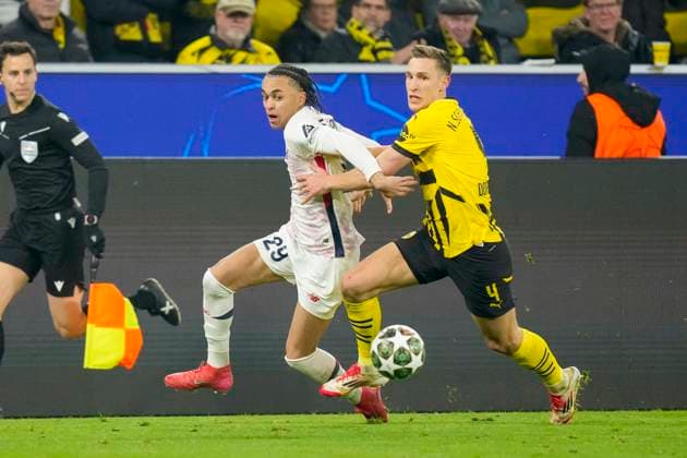 Ethan Mbappe LOSC Lille and Nico Schlotterbeck Borussia Dortmund battle for the ball during the UEFA Champions League 2024 25 Round of 16 First Leg match between Borussia Dortmund and LOSC Lille at Signal Iduna Park on March 4, 2025 in Dortmund, Germany