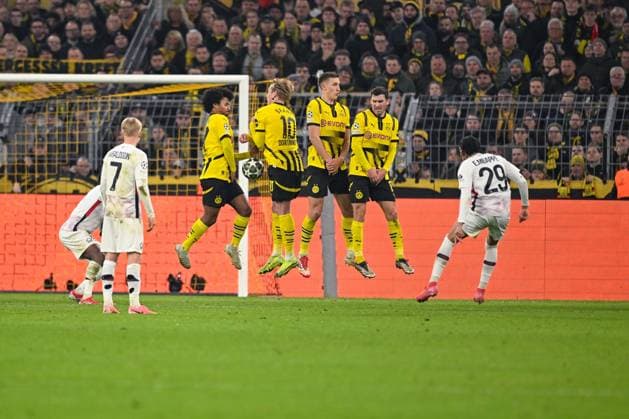 04 03 2025, Football UEFA Champions League 2024 2025, Round of 16, Borussia Dortmund Lille OSC, at Signal Iduna Park, Ethan MbappÃ OSC Lille shoots the free kick, Karim Adeyemi Borussia Dortmund , Julian Brandt Borussia Dortmund , Nico Schlotterbeck Borussia Dortmund , Pascal Groß Borussia Dortmund DFL and DFB regulations prohibit any use of photographs as image sequences and or quasi video