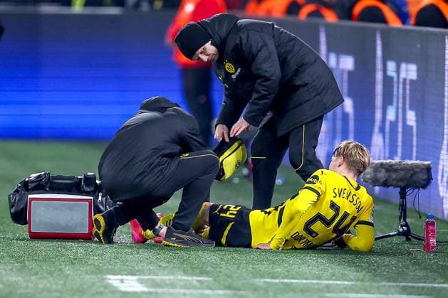 04 03 2025, Football, UEFA Champions League, Borussia Dortmund OSC Lille, Signal Iduna Park, Round of 16, 2024 2025 season Daniel Svensson BVB 24 is injured on the pitch with pain and requires medical treatment North Rhine-Westphalia Germany