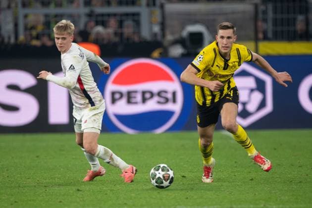 Nico SCHLOTTERBECK DO vs Hakon HARALDSSON LOSC Action, duel, Football Champions League, Round of 16, Borussia Dortmund DO OSC Lille LOSC 1 1 on 04 03 2025 in Dortmund Germany UEFA regulations prohibit any use of photographs as image sequences and or quasi video Â