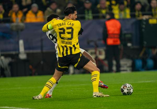Duel between Emre Can Borussia Dortmund, 23 and Jonathan David OSC Lille, 9 Borussia Dortmund vs OSC Lille, Football, UEFA Champions League, Round of 16, Season 2024 2025, 04 03 2025 DFL regulations prohibit any use of photographs as image sequences and or quasi video Copyright: HMBxMedia xMarcoxBader