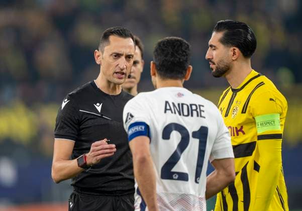 Jose Maria Sanchez Martinez Referee, Spain discusses with Benjamin Andre OSC Lille, 21 and Emre Can Borussia Dortmund, 23 Borussia Dortmund vs OSC Lille, Football, UEFA Champions League, Round of 16, Season 2024 2025, 04 03 2025 DFL regulations prohibit any use of photographs as image sequences and or quasi video Copyright: HMBxMedia xMarcoxBader