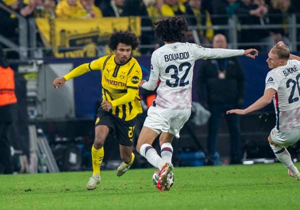 Duel between Karim Adeyemi Borussia Dortmund, 27 and Ayyoub Bouaddi OSC Lille, 32 Borussia Dortmund vs OSC Lille, Football, UEFA Champions League, Round of 16, Season 2024 2025, 04 03 2025 DFL regulations prohibit any use of photographs as image sequences and or quasi video Copyright: HMBxMedia xMarcoxBader