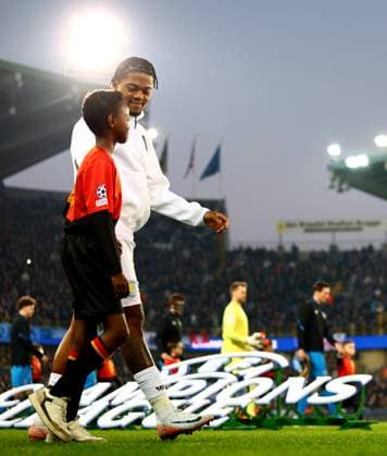 Leon Bailey of Aston Villa and mascot before kick off. Club Brugge v Aston Villa, UEFA Champions League, Round of 16, First Leg, Football, Jan Breydel Stadium, Brugge, Belgium - 04 Mar 2025 EDITORIAL USE ONLY No use with unauthorised audio, video, data, fixture lists, club league logos or live services. Online in-match use limited to 120 images, no video emulation. No use in betting, games or single club league player publications.  Copyright: xJamesxMarsh Shutterstockx 15176976dl
