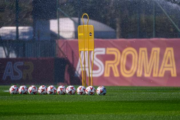A row of ball with the words ˜AS Roma™ in the background attends a training session the day before the Europa League football match between AS Roma and Athletic Bilbao at Centro Sportivo Fulvio Bernardini in Rome (Italy), March 5, 2025. AndreaxStaccioli
