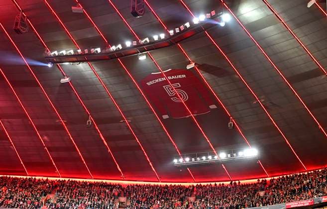 05 03 2025, Football UEFA Champions League 2024 2025 Round of 16, FC Bayern Munich Bayer 04 Leverkusen, in the Allianz Arena Munich the jersey of Franz Beckenbauer with the number 5 hangs under the stadium roof of the Allianz Arena as a reminder of the deceased, former Bayern player and club icon DFL and DFB regulations prohibit any use of photographs as image sequences and or quasi video
