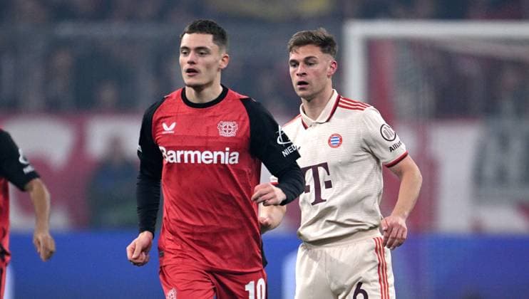 FOOTBALL CHAMPIONS LEAGUE SEASON 2024 2025 Round of 16 first leg FC Bayern Muenchen Bayer 04 Leverkusen 05 03 2025 Florian Wirtz left, Bayer 04 Leverkusen with Joshua Kimmich right, FC Bayern Muenchen