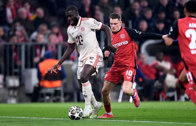 FOOTBALL CHAMPIONS LEAGUE SEASON 2024 2025 Round of 16 first leg FC Bayern Muenchen Bayer 04 Leverkusen 05 03 2025 Dayot Upamecano left, FC Bayern Muenchen vs Florian Wirtz right, Bayer 04 Leverkusen