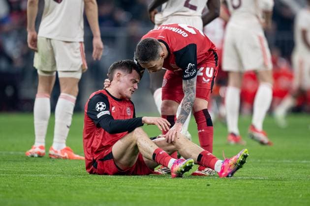 Alejandro Grimaldo Bayer 04 Leverkusen, 20 inquires about the condition of Florian Wirtz Bayer 04 Leverkusen, 10 , who is sitting on the pitch in pain GER, FC Bayern Muenchen vs Bayer 04 Leverkusen, Football, Champions League, Round of 16, First leg, Season 2024 2025, 05 03 DFL DFB REGULATIONS PROHIBIT ANY USE OF PHOTOGRAPHS as IMAGE SEQUENCES and or QUASI VIDEO GER, FC Bayern Muenchen vs Bayer 04 Leverkusen, Football, Champions League, Round of 16, First leg, Season 2024 2025, 05 03 Muenchen Copyright: xEibner-Pressefoto HeikexFeinerx EP_HFR