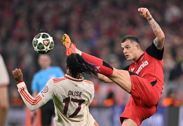 duel, action Granit Xhaka Bayer 04 Leverkusen 34 vs Michael Olise FC Bayern Muenchen FCB 17 FC Bayern Muenchen FCB vs Bayer 04 Leverkusen B04 Round of 16 first leg 05 03 2025 DFL REGULATIONS PROHIBIT ANY USE OF PHOTOGRAPHS AS IMAGE SEQUENCES AND OR QUASI VIDEO FC Bayern Muenchen FCB vs Bayer 04 Leverkusen B04