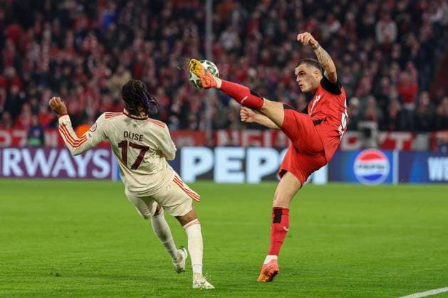 in duel, action, with Michael Olise 17 FC Bayern Muenchen , Granit Xhaka 34 Bayer 04 Leverkusen , FC Bayern Muenchen vs Bayer 04 Leverkusen, football, Champions League, round of 16, first leg, 05 03 2025 Muenchen Bayern Germany Copyright: xkolbert-press ChristianxKolbertx
