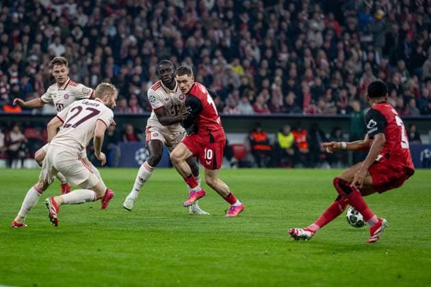 Joshua Kimmich FC Bayern Muenchen, 6 , Konrad Laimer FC Bayern Muenchen, 27 and Dayot Upamecano FC Bayern Muenchen, 2 defend against Florian Wirtz Bayer 04 Leverkusen, 10 GER, FC Bayern Muenchen vs Bayer 04 Leverkusen, Football, Champions League, Round of 16, First leg, 2024 2025 season, 05 03 DFL DFB REGULATIONS PROHIBIT ANY USE OF PHOTOGRAPHS as IMAGE SEQUENCES and or QUASI VIDEO GER, FC Bayern Muenchen vs Bayer 04 Leverkusen, Football, Champions League, Round of 16, First leg, 2024 2025 season, 05 03 Muenchen Copyright: xEibner-Pressefoto HeikexFeinerx EP_HFR