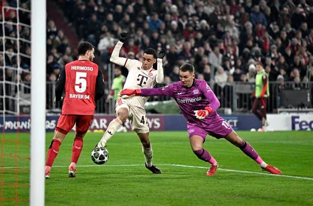 05 03 2025, Football UEFA Champions League 2024 2025 Round of 16, FC Bayern Munich Bayer 04 Leverkusen, at Allianz Arena Munich Goal to 2 0 by scorer Jamal Musiala Bayern Munich after mistake by goalkeeper Matej Kovar Bayer Leverkusen DFL and DFB regulations prohibit any use of photographs as image sequences and or quasi video