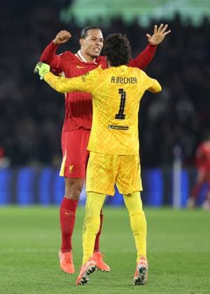 Paris, France, 5th March 2025. Virgil van Dijk of Liverpool and Alisson Becker of Liverpool celebrate after Harvey Elliott (not pictured) of Liverpool scores the opening goal during the UEFA Champions League match Paris Saint Germain vs Liverpool at Le Parc des Princes, Paris. Picture credit should read: Paul Terry Sportimage EDITORIAL USE ONLY. No use with unauthorised audio, video, data, fixture lists, club league logos or live services. Online in-match use limited to 120 images, no video emulation. No use in betting, games or single club league player publications. SPI_026_PT_PSG_Liverpool SPI-3726-0026