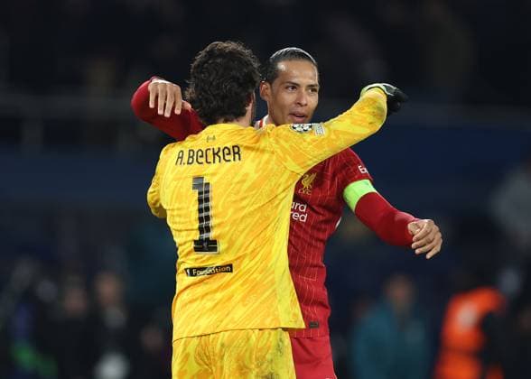 Paris, France, 5th March 2025. Virgil van Dijk of Liverpool celebrates with Alisson Becker of Liverpool after the UEFA Champions League match Paris Saint Germain vs Liverpool at Le Parc des Princes, Paris. Picture credit should read: Paul Terry Sportimage EDITORIAL USE ONLY. No use with unauthorised audio, video, data, fixture lists, club league logos or live services. Online in-match use limited to 120 images, no video emulation. No use in betting, games or single club league player publications. SPI_034_PT_PSG_Liverpool SPI-3726-0034