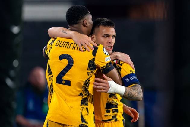 2025-03-05 Feyenoord v FC Internazionale Milano - UEFA Champions League 2024 25 Round of 16 First Leg ROTTERDAM, NETHERLANDS - MARCH 5: Lautaro Martinez of FC Internazionale Milano celebrates after scoring the team s second goal with Denzel Dumfries of FC Internazionale Milano during the UEFA Champions League 2024 25 Round of 16 First Leg match between Feyenoord and FC Internazionale Milano at Stadion Feijenoord on March 5, 2025 in Rotterdam, Netherlands. Rotterdam Stadion Feijenoord Netherlands Content not available for redistribution in The Netherlands directly or indirectly through any third parties. Copyright: xJorisxVerwijstx