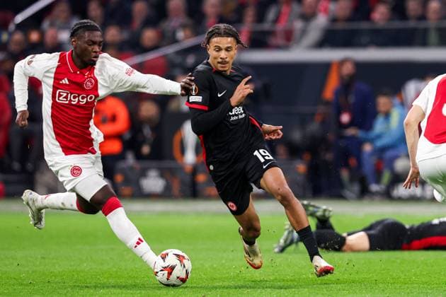 2025-03-06 AFC Ajax v Eintracht Frankfurt - UEFA Europa League 2024 25 Round of 16 First Leg AMSTERDAM, NETHERLANDS - MARCH 6: Jorthy Mokio of AFC Ajax battles for possession with Jean-Matteo Bahoya of Eintracht Frankfurt during to the UEFA Europa League 2024 25 Round of 16 First Leg match between AFC Ajax and Eintracht Frankfurt at Johan Cruijff ArenA on March 6, 2025 in Amsterdam, Netherlands. Amsterdam Johan Cruijff ArenA Netherlands Content not available for redistribution in The Netherlands directly or indirectly through any third parties. Copyright: xBenxGalx