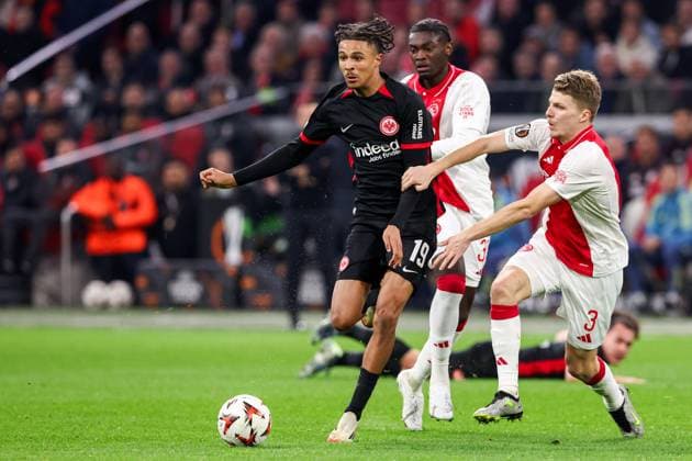 2025-03-06 AFC Ajax v Eintracht Frankfurt - UEFA Europa League 2024 25 Round of 16 First Leg AMSTERDAM, NETHERLANDS - MARCH 6: Jorthy Mokio of AFC Ajax battles for possession with Jean-Matteo Bahoya of Eintracht Frankfurt and Anton Gaaei of AFC Ajax during to the UEFA Europa League 2024 25 Round of 16 First Leg match between AFC Ajax and Eintracht Frankfurt at Johan Cruijff ArenA on March 6, 2025 in Amsterdam, Netherlands. Amsterdam Johan Cruijff ArenA Netherlands Content not available for redistribution in The Netherlands directly or indirectly through any third parties. Copyright: xBenxGalx