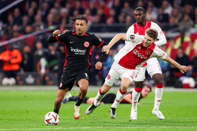 2025-03-06 AFC Ajax v Eintracht Frankfurt - UEFA Europa League 2024 25 Round of 16 First Leg AMSTERDAM, NETHERLANDS - MARCH 6: Jorthy Mokio of AFC Ajax battles for possession with Jean-Matteo Bahoya of Eintracht Frankfurt and Anton Gaaei of AFC Ajax during to the UEFA Europa League 2024 25 Round of 16 First Leg match between AFC Ajax and Eintracht Frankfurt at Johan Cruijff ArenA on March 6, 2025 in Amsterdam, Netherlands. Amsterdam Johan Cruijff ArenA Netherlands Content not available for redistribution in The Netherlands directly or indirectly through any third parties. Copyright: xBenxGalx
