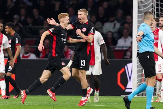 2025-03-06 AFC Ajax v Eintracht Frankfurt - UEFA Europa League 2024 25 Round of 16 First Leg AMSTERDAM, NETHERLANDS - MARCH 6: Hugo Larsson of Eintracht Frankfurt, Rasmus Kristensen of Eintracht Frankfurt celebrates after scoring the first goal of the team during the UEFA Europa League 2024 25 Round of 16 First Leg match between AFC Ajax and Eintracht Frankfurt at Johan Cruijff ArenA on March 6, 2025 in Amsterdam, Netherlands. Amsterdam Johan Cruijff ArenA Netherlands Content not available for redistribution in The Netherlands directly or indirectly through any third parties. Copyright: xHansxvanxderxValkx