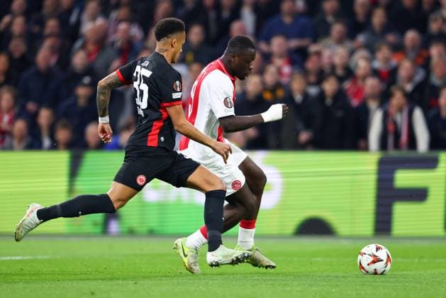 AMSTERDAM, 06-03-2025 , JohanCruyff Arena , UEFA Europa League Football season 2024 2025 , match between Ajax and Eintracht Frankfurt. (L-R) Eintracht Frankfurt player Tuta, Ajax player Brian Brobbey Ajax - Eintracht Frankfurt  x28190786x Copyright: