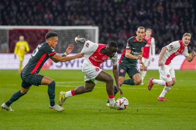 Football UEFA Europa League 2024 2025, round of 16 Ajax Amsterdam vs Eintracht Frankfurt Johan Cruijff ArenA Amsterdam, Netherlands Brian Brobbey Ajax Amsterdam, 9 on the ball, Tuta Eintracht Frankfurt, 35 cant stop him Copyright: xJOERANxSTEINSIEKx