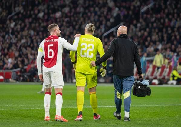 Amsterdam The Netherlands 6th March 2025 Football - UEFA Europa League knockout stage match AFC Ajax Amsterdam vs Eintracht Frankfurt in the Amsterdam Johan Cruijff Arena. Ajax keeper Remko Pasveer has to leave the field early. Captain Jordan Henderson has a sympathetic hand game, match, wedstrijd, soccer