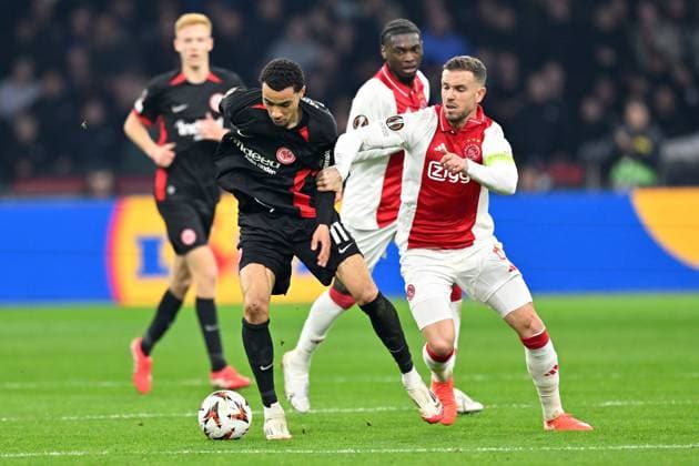 Amsterdam, Johan Cruijff Arena, 06 03 25, NLD, Men, UEFA Europa League, Season 2024 2025, Ajax Amsterdam Eintracht Frankfurt Picture from left in duel Hugo EKITIKE Frankfurt and Jordan HENDERSON Ajax UEFA regulations prohibit any use of photographs as image sequences and or quasi video North Holland Netherlands