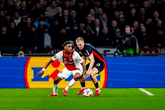 AFC Ajax Amsterdam defender Jorrel Hato, Eintracht Frankfurt defender Rasmus Kristensen during the match Ajax Eintracht at the Johan Cruijff ArenA for the UEFA Europa League Round of 16 1st leg season 2024 2025 in AMSTERDAM, Netherlands on 6 march 2025, photo by Marcel van Dorst EYE4images DeFodi Images