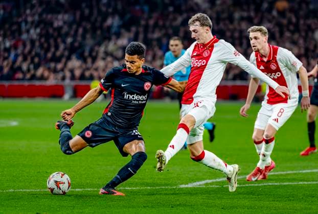 Eintracht Frankfurt midfielder Ansgar Knauff, AFC Ajax Amsterdam defender Youri Baas during the match Ajax Eintracht at the Johan Cruijff ArenA for the UEFA Europa League Round of 16 1st leg season 2024 2025 in AMSTERDAM, Netherlands on 6 march 2025, photo by Marcel van Dorst EYE4images DeFodi Images