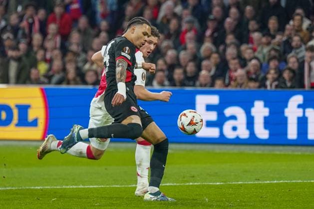 Football UEFA Europa League 2024 2025, round of 16 Ajax Amsterdam vs Eintracht Frankfurt Johan Cruijff ArenA Amsterdam, Netherlands Nnamdi Collins Eintracht Frankfurt, 34 and Mika Godts Ajax Amsterdam, 11 Copyright: xJOERANxSTEINSIEKx