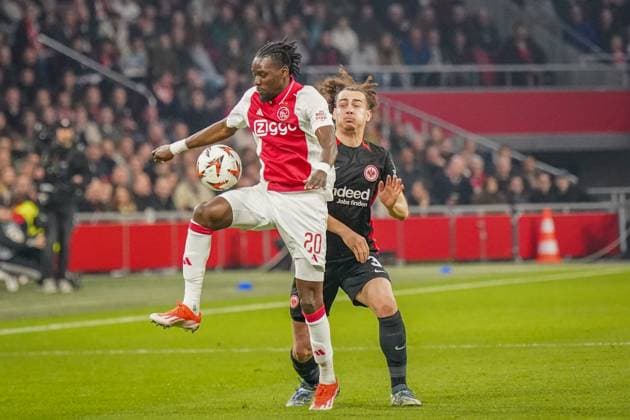Football UEFA Europa League 2024 2025, round of 16 Ajax Amsterdam vs Eintracht Frankfurt Johan Cruijff ArenA Amsterdam, Netherlands Bertrand TraorÃ Traore Ajax Amsterdam, 20 with Arthur Theate Eintracht Frankfurt, 3 Copyright: xJOERANxSTEINSIEKx