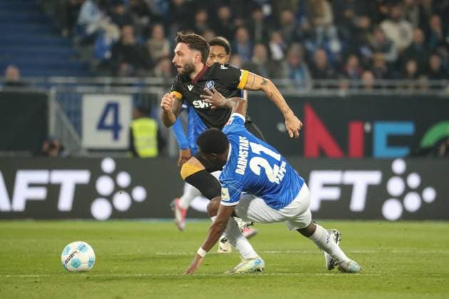 Darmstadt, Germany 07 March 2025 2 Liga 2024 2025 SV Darmstadt 98 vs Karlsruher SC In picture from left in duel Fabian Schleusener Karlsruher SC, 24 , Merveille Papela Darmstadt, 21 , DFL regulations prohibit any use of photographs as image sequences and or quasi video Merck Stadion am Böllenfalltor Hessen Copyright: xFotostandx xUlrichxScherbaumx