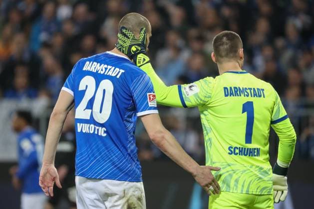 Darmstadt, Germany 07 March 2025 2 Liga 2024 2025 SV Darmstadt 98 vs Karlsruher SC Pictured from left Aleksandar Vukotic Darmstadt, 20 , Goalkeeper Marcel Schuhen Darmstadt, 1 , DFL regulations prohibit any use of photographs as image sequences and or quasi video Merck Stadion am Böllenfalltor Hessen Copyright: xFotostandx xUlrichxScherbaumx