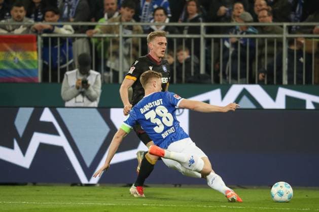 Darmstadt, Germany 07 March 2025 2 Liga 2024 2025 SV Darmstadt 98 vs Karlsruher SC In picture from left in duel Mikkel Kaufmann Karlsruher SC, 14 , Clemens Riedel Darmstadt, 38 , DFL regulations prohibit any use of photographs as image sequences and or quasi video Merck Stadion am Böllenfalltor Hessen Copyright: xFotostandx xUlrichxScherbaumx