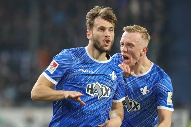 Darmstadt, Germany 07 March 2025 2 Liga 2024 2025 SV Darmstadt 98 vs Karlsruher SC In the picture from left goal scorer Killian Corredor Darmstadt, 34 cheers after his goal to 2 0 with Isac Lidberg Darmstadt, 7 in the 73rd minute of the match DFL regulations prohibit any use of photographs as image sequences and or quasi video Merck Stadion am Böllenfalltor Hessen Copyright: xFotostandx xUlrichxScherbaumx