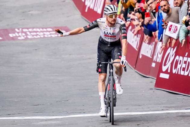 Belgian Tim Wellens of UAE Team Emirates celebrates as he crosses the finish line at the men elite Strade Bianche one day cycling race, 213km from and to Siena, Italy on Saturday 08 March 2025. DIRKxWAEM  x114505349x