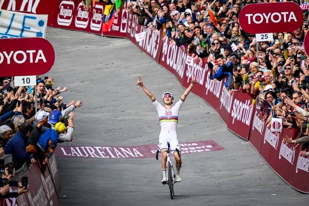 Slovenian Tadej Pogacar of UAE Team Emirates celebrates as he crosses the finish line to win the men elite Strade Bianche one day cycling race, 213km from and to Siena, Italy on Saturday 08 March 2025. DIRKxWAEM  x114505669x