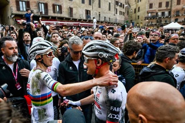 Slovenian Tadej Pogacar of UAE Team Emirates and Belgian Tim Wellens of UAE Team Emirates celebrate after winning the men elite Strade Bianche one day cycling race, 213km from and to Siena, Italy on Saturday 08 March 2025. DIRKxWAEM  x114506300x