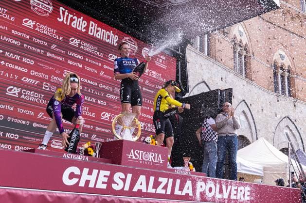 Strade Bianche 2025 - Women Elite Finish And Podium The podium of Strade Bianche Women Elite 2025 includes (from left) Anna Van der Breggen, Demi Vollering, and Pauline Ferrand-Prevot opening champagne , in Siena, Italy, on march 08, 2025. Siena Italy  Copyright: xTommasoxBerardix originalFilename:berardi-stradebi250308_npEGC.jpg