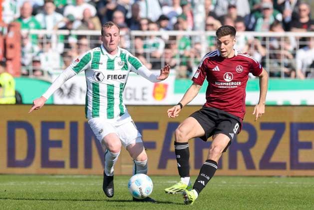 Simon Scherder SC Preussen Muenster and Stefanos Tzimas 1 FC Nuernberg battle for the ball, 2 Bundesliga, Preußen Münster vs 1 FC Nürnberg, Preußenstadion, March 09, 2025 in Münster, Germany Photo by Marco Steinbrenner DeFodi Images Simon Scherder SC Preussen Muenster and Stefanos Tzimas 1 FC Nuernberg battle for the ball, 2 Bundesliga, Preußen Münster vs 1 FC Nürnberg, Preußenstadion, March 9, 2025 in Münster, Germany Photo by Marco Steinbrenner DeFodi Images DFB DFL REGULATIONS PROHIBIT ANY USE OF PHOTOGRAPHS AS IMAGE SEQUENCES AND OR QUASI VIDEO