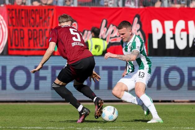 Tim Drexler 1 FC Nuernberg and Florian Pick SC Preussen Muenster battle for the ball, 2 Bundesliga, Preußen Münster vs 1 FC Nürnberg, Preußenstadion, March 09, 2025 in Münster, Germany Photo by Marco Steinbrenner DeFodi Images Tim Drexler 1 FC Nuernberg and Florian Pick SC Preussen Muenster battle for the ball, 2 Bundesliga, Preußen Münster vs 1 FC Nürnberg, Preußenstadion, March 9, 2025 in Münster, Germany Photo by Marco Steinbrenner DeFodi Images DFB DFL REGULATIONS PROHIBIT ANY USE OF PHOTOGRAPHS AS IMAGE SEQUENCES AND OR QUASI VIDEO