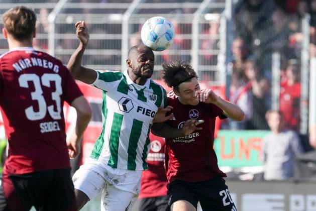 David Kinsombi SC Preussen Muenster and Caspar Jander 1 FC Nuernberg battle for the ball, 2 Bundesliga, Preußen Münster vs 1 FC Nürnberg, Preußenstadion, March 09, 2025 in Münster, Germany Photo by Marco Steinbrenner DeFodi Images David Kinsombi SC Preussen Muenster and Caspar Jander 1 FC Nuernberg battle for the ball, 2 Bundesliga, Preußen Münster vs 1 FC Nürnberg, Preußenstadion, March 9, 2025 in Münster, Germany Photo by Marco Steinbrenner DeFodi Images DFB DFL REGULATIONS PROHIBIT ANY USE OF PHOTOGRAPHS AS IMAGE SEQUENCES AND OR QUASI VIDEO