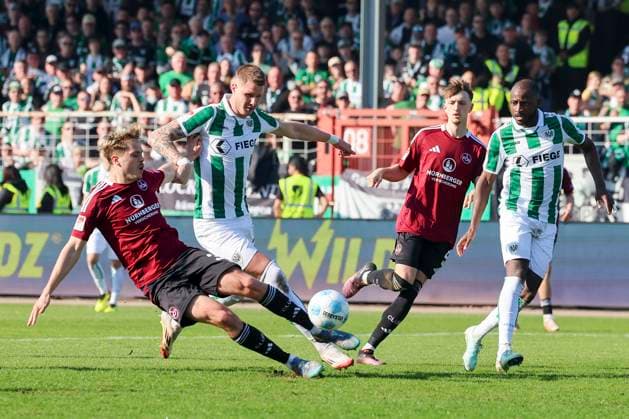 Nick Seidel 1 FC Nuernberg , Holmbert Fridjonsson SC Preussen Muenster , Tim Drexler 1 FC Nuernberg and David Kinsombi SC Preussen Muenster battle for the ball, 2 Bundesliga, Preußen Münster vs 1 FC Nürnberg, Preußenstadion on March 09, 2025 in Münster, Germany Photo by Marco Steinbrenner DeFodi Images Nick Seidel 1 FC Nuernberg , Holmbert Fridjonsson SC Preussen Muenster , Tim Drexler 1 FC Nuernberg and David Kinsombi SC Preussen Muenster battle for the ball, 2 Bundesliga, Preußen Münster vs 1 FC Nürnberg, Preußenstadion, March 9, 2025 in Münster, Germany Photo by Marco Steinbrenner DeFodi Images DFB DFL REGULATIONS PROHIBIT ANY USE OF PHOTOGRAPHS AS IMAGE SEQUENCES AND OR QUASI VIDEO
