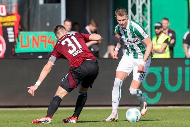Robin Knoche 1 FC Nuernberg and Holmbert Fridjonsson SC Preussen Muenster battle for the ball, 2 Bundesliga, Preußen Münster vs 1 FC Nürnberg, Preußenstadion, March 09, 2025 in Münster, Germany Photo by Marco Steinbrenner DeFodi Images Robin Knoche 1 FC Nuernberg and Holmbert Fridjonsson SC Preussen Muenster battle for the ball, 2 Bundesliga, Preußen Münster vs 1 FC Nürnberg, Preußenstadion, March 9, 2025 in Münster, Germany Photo by Marco Steinbrenner DeFodi Images DFB DFL REGULATIONS PROHIBIT ANY USE OF PHOTOGRAPHS AS IMAGE SEQUENCES AND OR QUASI VIDEO