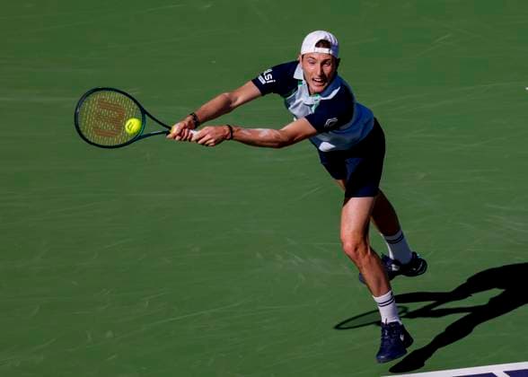 March 09, 2025 Ugo Humbert (FRA) returns a shot against Holger Rune (DEN) during the 2025 BNP Paribas Open at Indian Wells Tennis Garden in Indian Wells, California. Mandatory Photo Credit: CSM Indian Wells United States of America - ZUMAc04_ 20250309_zma_c04_184 Copyright: xCharlesxBausx