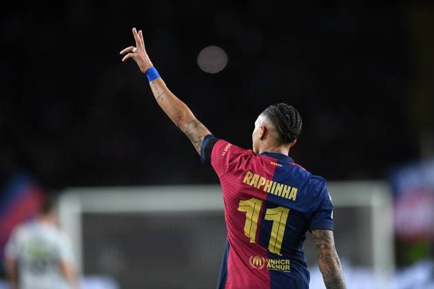 FC Barcelona, Barca v SL BENFICA OLIMPIC STADIUM LLUIS COMPANYS. MONTJUIC,BARCELONA.March 11,2025 FC BARCELONA vs SL BENFICA March 11,2025 Raphina (11) of FC Barcelona celebrates scoring his team s third goal during the UEFA Champions League 2024 25 quarter-final second leg match between FC Barcelona and SL Benfica at Olimpic Stadium Lluis Companys of MontjuÃ¯c in Barcelona, Spain. Barcelona ESP Copyright: xS.xRosx