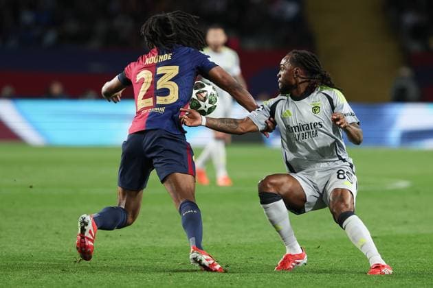 Barcelona 11 March 2025 Uefa Champions League phase 2024 25 Round of 16 FC Barcelona S L Benfica v l , Jules Kounde FC Barcelona , Reanto Sanches S L Benfica , duel, action, action, battles for the ball Copyright: JoaquimxFerreira