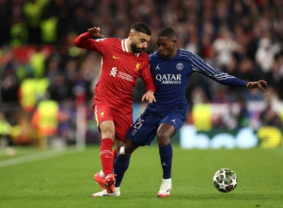 Mohamed Salah of Liverpool and Nuno Mendes Paris Saint-Germain Liverpool v Paris Saint-Germain, UEFA Champions League, Round of 16, Second Leg, Football, Anfield, Liverpool, UK - 11 Mar 2025 EDITORIAL USE ONLY No use with unauthorised audio, video, data, fixture lists, club league logos or live services. Online in-match use limited to 120 images, no video emulation. No use in betting, games or single club league player publications. Copyright: xRyanxBrowne Shutterstockx 15188180ar