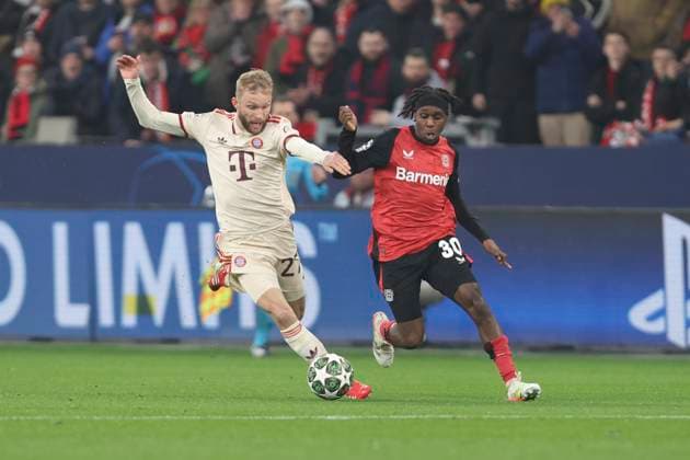 Konrad Laimer FC Bayern München and Jeremie Frimpong Bayer 04 Leverkusen battle for the ball during the UEFA Champions League 2024 25 Round of 16 Second Leg match between Bayer 04 Leverkusen and FC Bayern München at BayArena on March 11, 2025 in Leverkusen, Germany Photo by Oliver Kaelke DeFodi Images